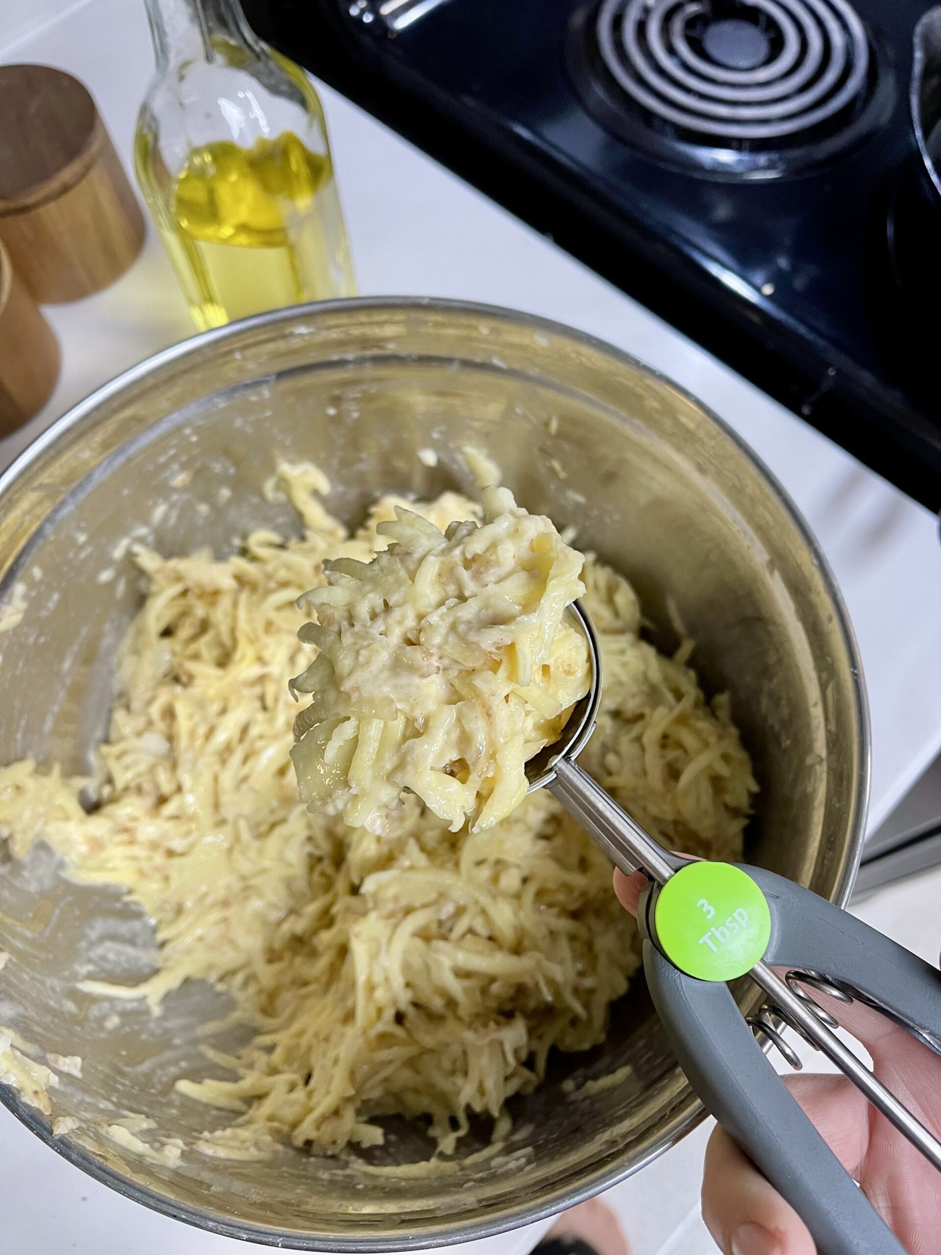 the potato pancake batter scooped and ready to go.