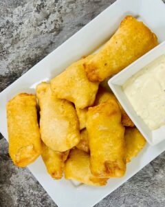 a platter of fried fish with tartar sauce