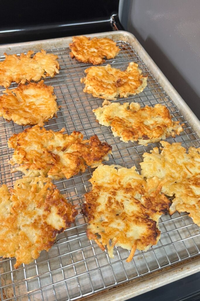 crispy potato pancakes on a cooling rack
